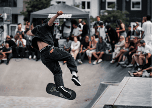 A man doing jump tricks at a skate park. Skate events