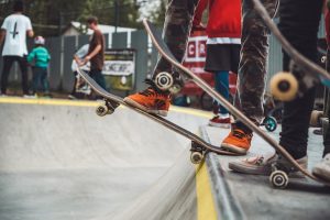 Skateboarders getting ready for their tricks. Skateboarding has many amazing benefits.