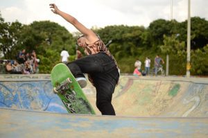 A man is riding an electric skateboard motor