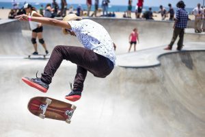 There are skateboarders in the skatepark