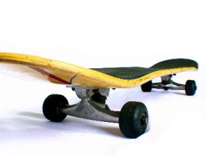 A yellow skateboard with clean wheels 