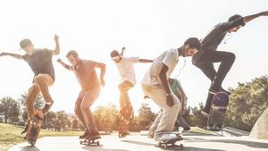 A group of men are on their respective skateboards