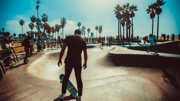 skateboarding safety for novices - Skateboarder and her skateboard