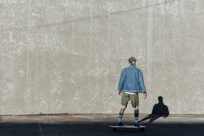 A skater practicing skateboarding with his skateboard