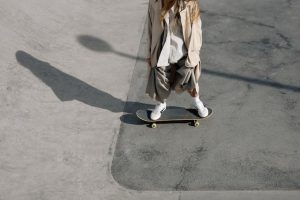 A skateboarder standing on his skateboard. Even experienced skateboarders need training before entering and competing in a skateboard competition. 