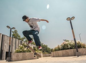 Competitive skateboarder practicing skateboarding.
