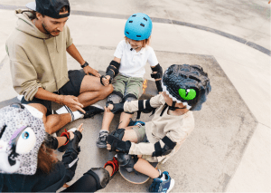 Pro skateboarder teaching kids beginning skateboarding lessons