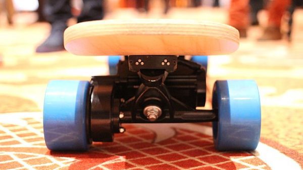  a close up shot of a blue-wheeled old-school board with wheels and bearings. 