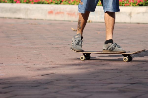 A guy using his board and trying to balance. 