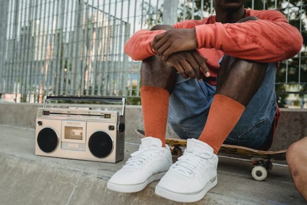 a guy listening to music - from punk rock to hip-hop with its rebellious spirit before skating away.