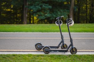 There are different types of options we can consider to determine which one is the best electric scooter. It's important to assess factors such as battery life, maximum speed, build quality, and price point. This picture shows us two electric scooter best parked near the roadside 