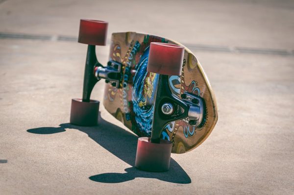Graphic arts decorate the surfaces of skateboard decks reflecting the artistry of the skateboard culture.