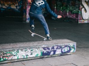 Longboard trick in a small ramp.