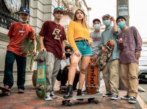 Friends with skateboards wearing their best skateboard brands of skateboard gears are now ready to enjoy their skateboard.