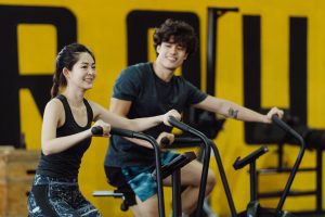 two best friends enjoying their workout in a fitness room