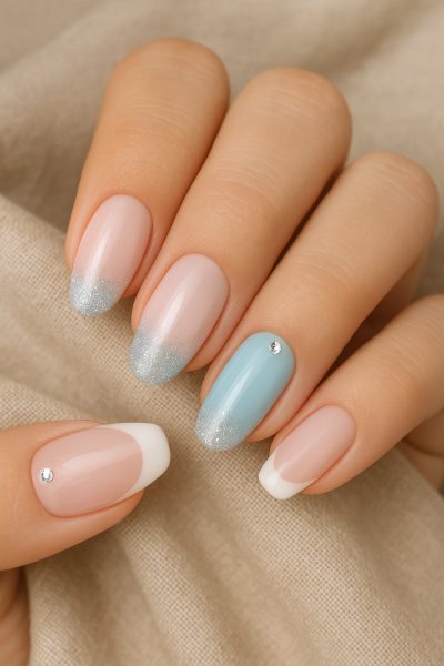 Elegant beginner acrylic nails with pastel gels, rhinestones, and glitter on soft linen.