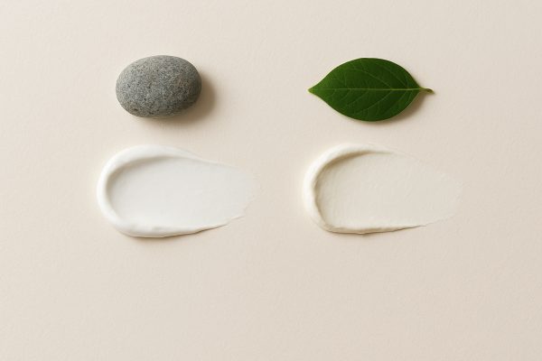 Flat lay of titanium and zinc oxide sunscreen swatches.